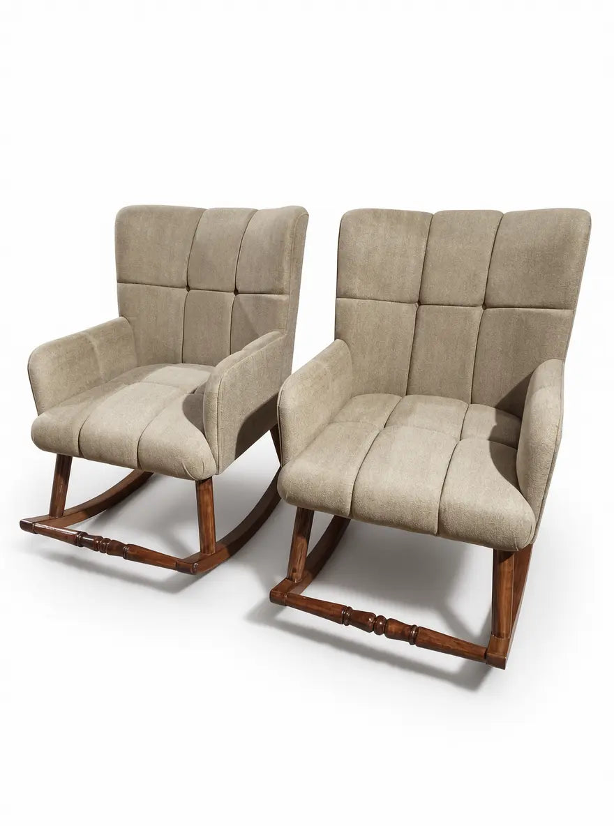 Two upholstered rocking chairs with high tufted backs, padded seats, and dark wood rockers, shown on a clean white studio background.