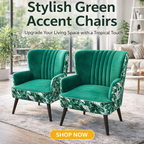 Two green accent chairs with vertical channel tufting and tropical leaf-patterned fabric on the arms and lower skirts, shown in a bright living room setting with large windows and a 'SHOP NOW' button overlay.