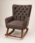 A classic wingback armchair with a tufted button-back high backrest, upholstered in a textured brown fabric, supported by a warm brown wooden rocking base.